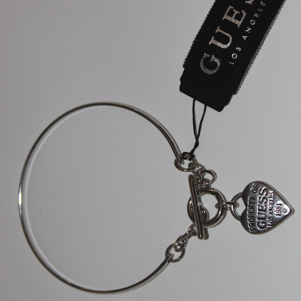 guess women's silver tone bangle bracelet